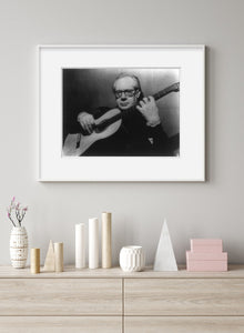 Vintage Photograph of Andres Segovia Summary: 1/2. Seated, with guitar.