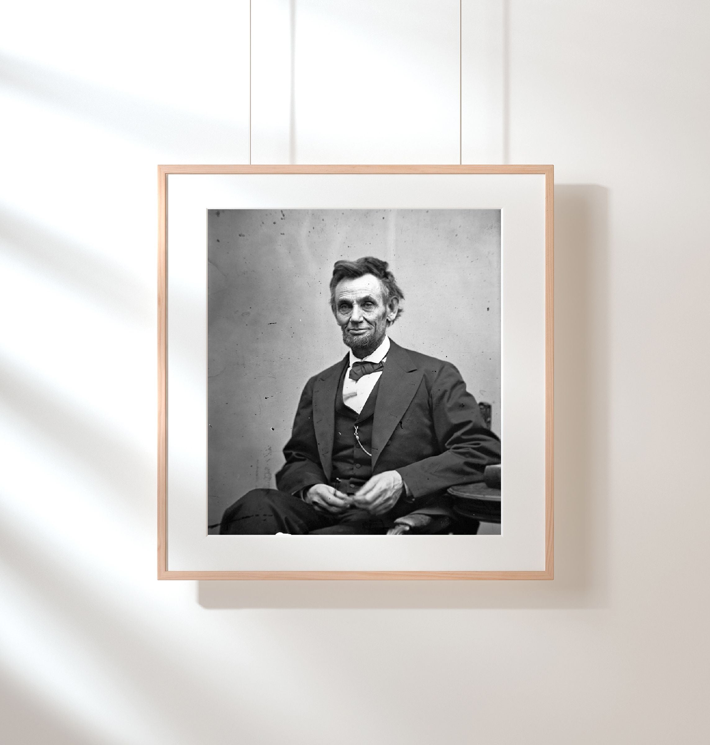 1865 Photo Abraham Lincoln, three-quarter length portrait, seated and holding hi
