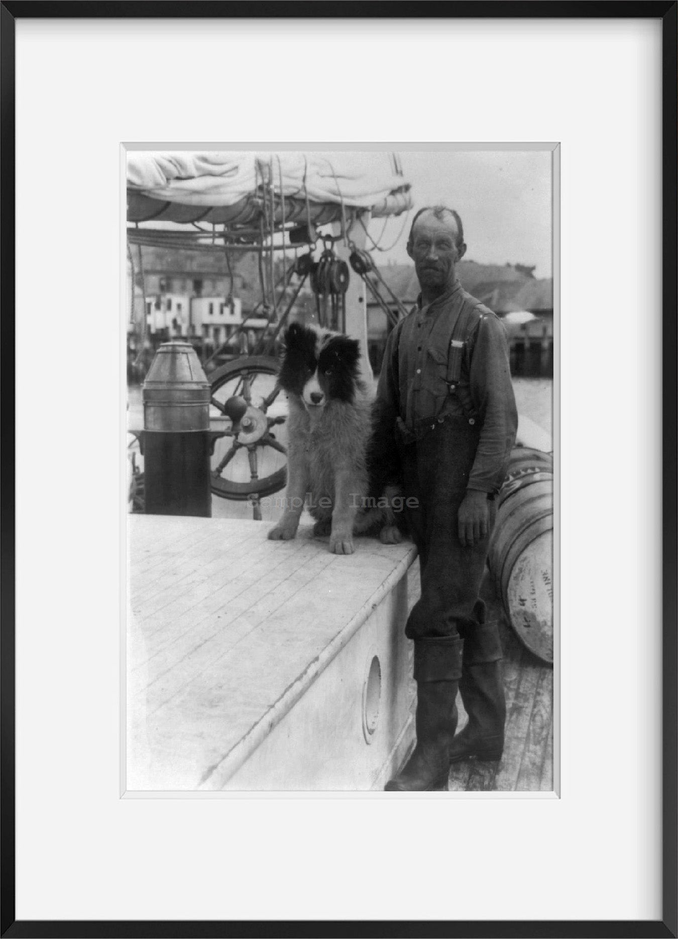 c1922 photograph of Job Small and dog Summary: Man and dog on deck of Arctic shi