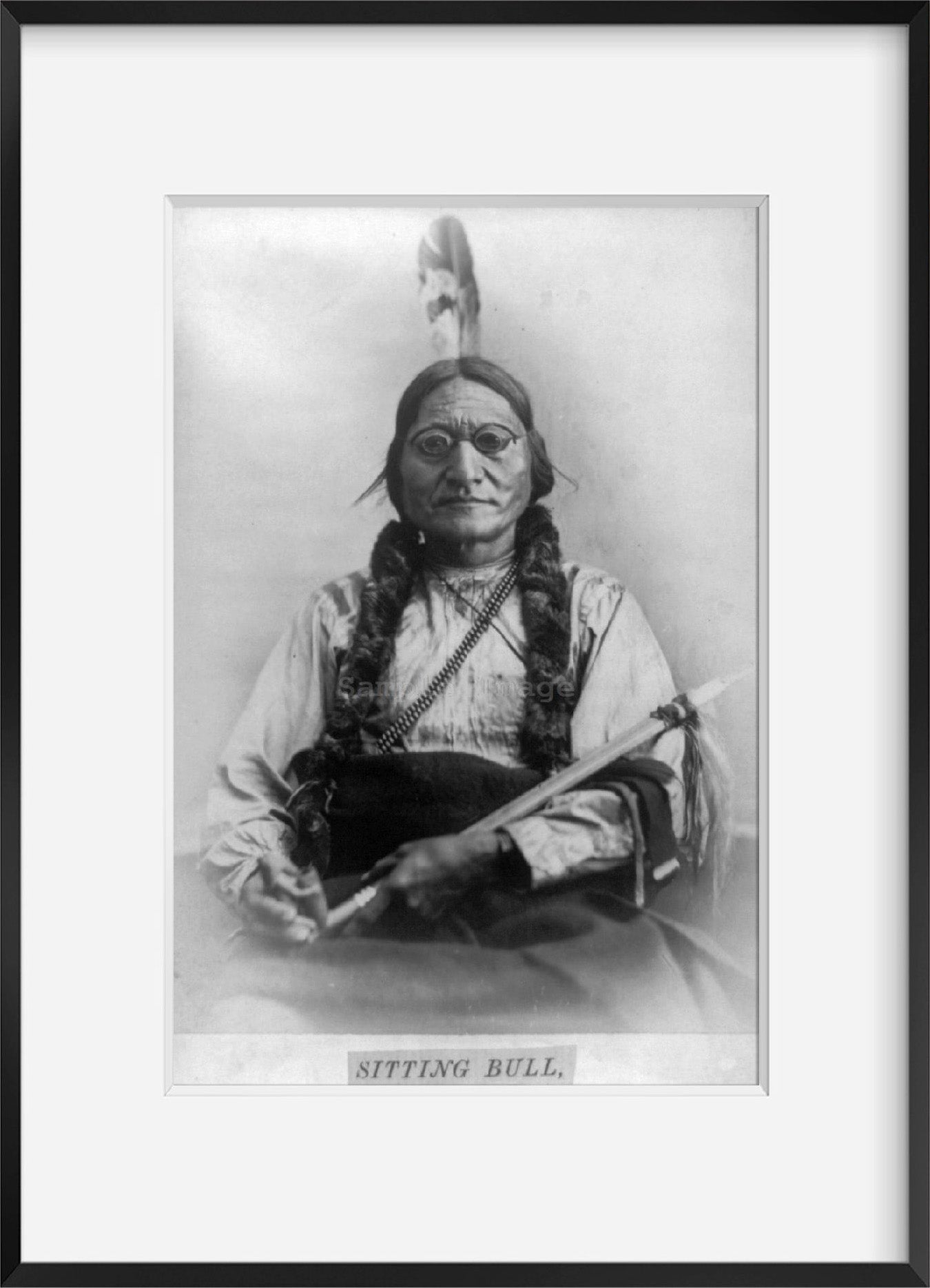 c1881 photograph of Sitting Bull, half-length portrait, seated, facing front, ho