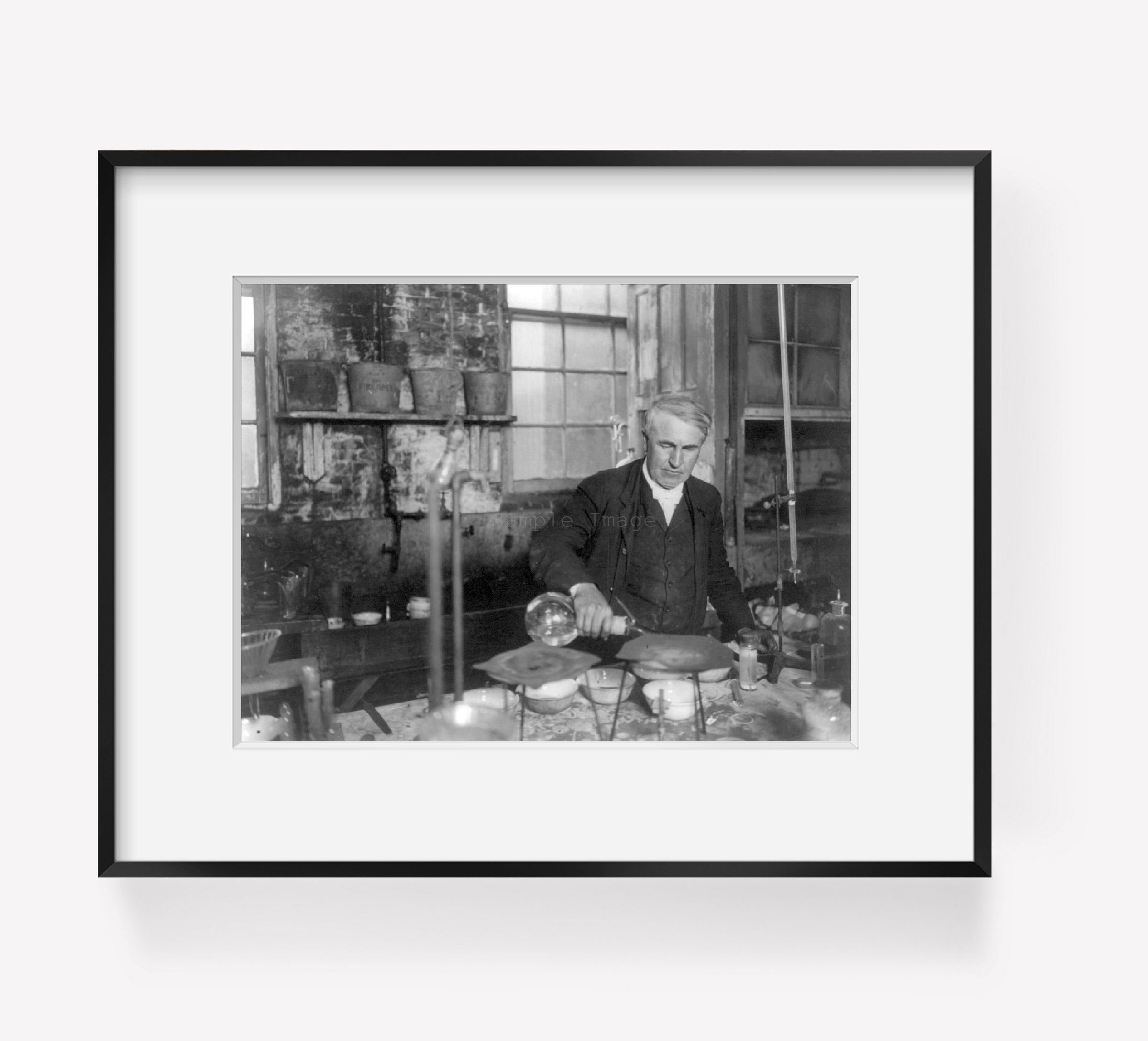 c1905 photograph of Thomas Alva Edison, 1847-1931, half-length portrait, working