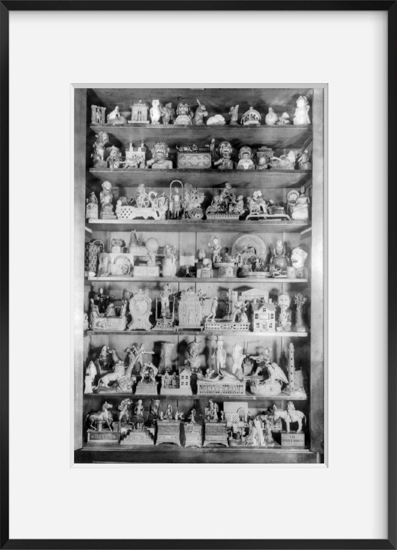 Photo: Shelf display of 100 rare penny banks, c1937, photo by Andrew Emerine, cabin