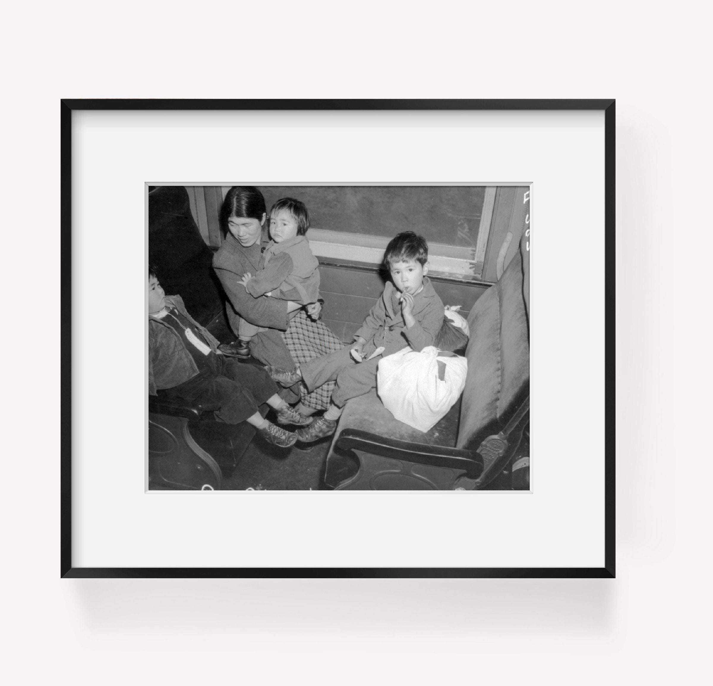 Photo: Mother, Children, on train from Los Angeles to Manzanar, California, War