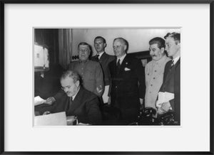 Photo: Molotov signing Russo-German pact in Moskov;Stalin, Ribbentrop, September 1