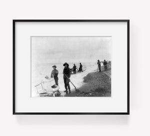 between 1901 and 1903 photograph of Rocking gold on sea shore near Nome, Alaska