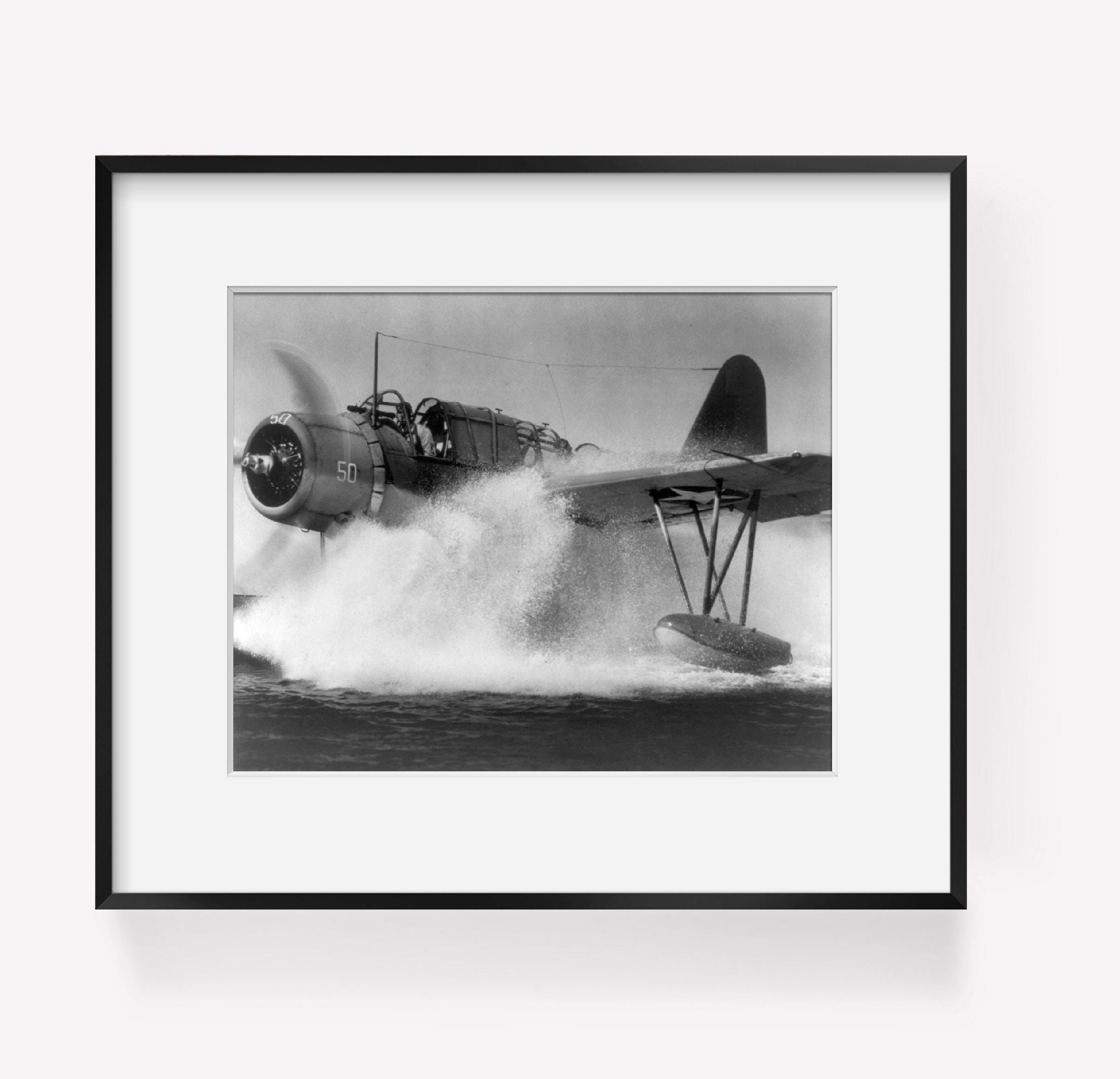 Photo: Kingfisher observation-scout plane, pontoon landing, submarine patrol, 1943