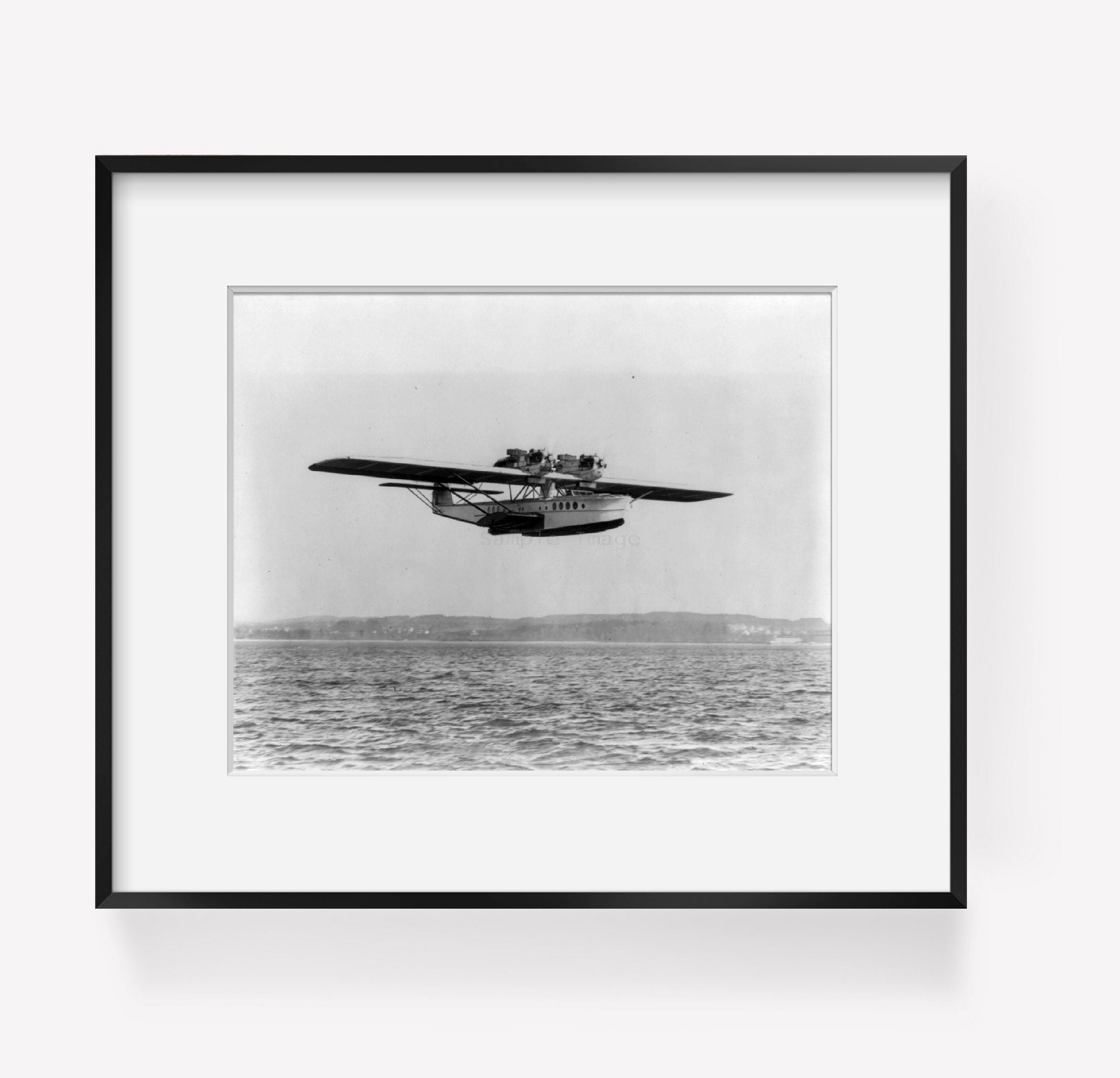 ca. 1928 photograph of Dornier seaplane flying low over water