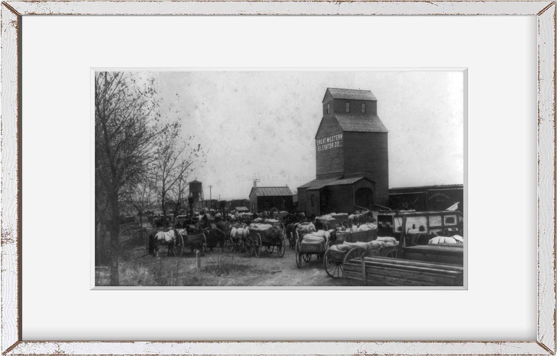 Photo: Horse-drawn wagons, railroad freight depot, grain elevator, Mandan, Morton Co