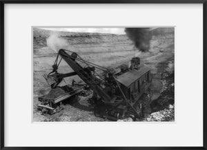 Photo: Steam shovel loading ore cars in open pit copper mine, Santa Rita, Grant Co