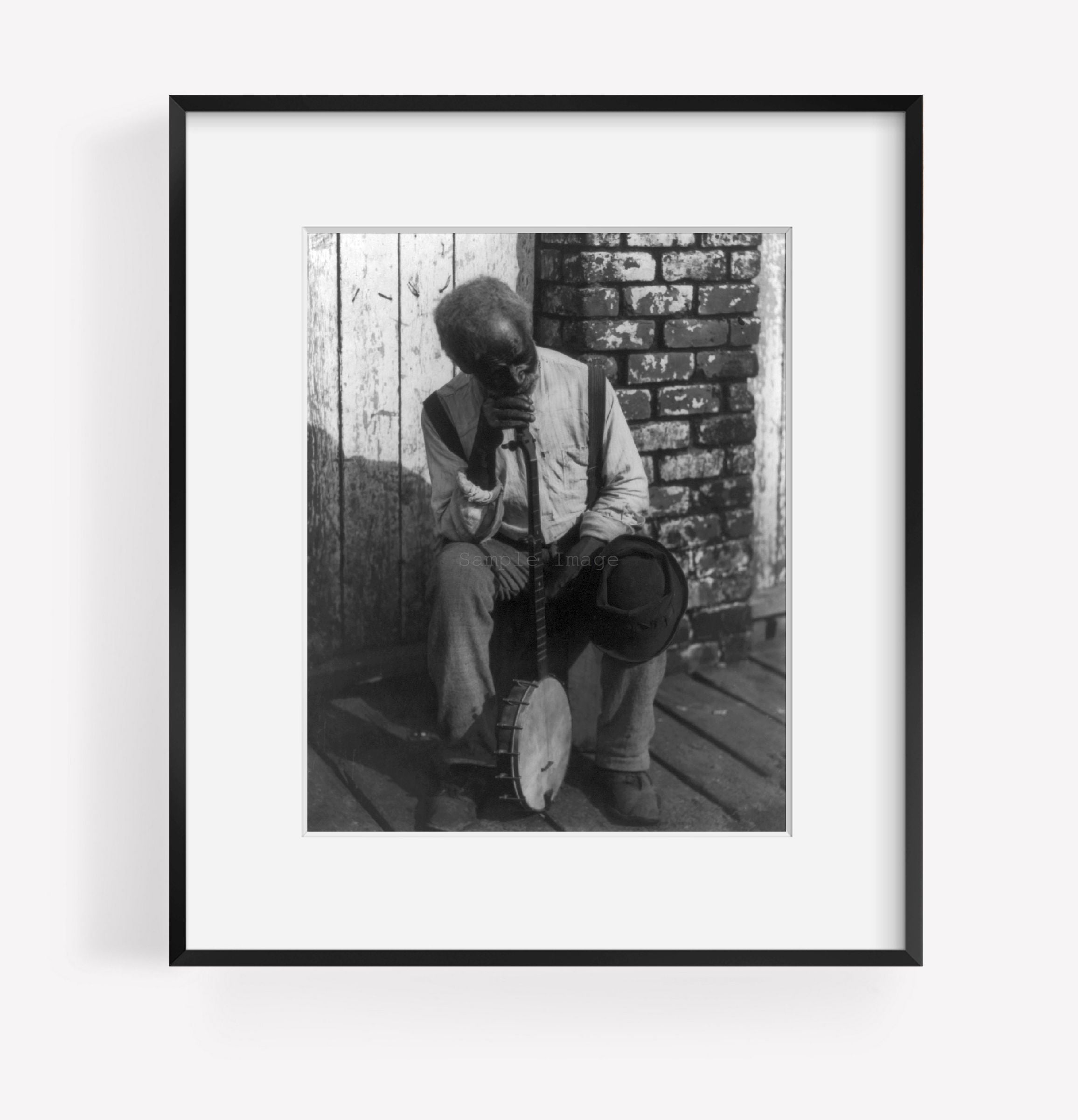 Photo: 'Retrospection'. Old Negro man sitting, leaning on banjo, c1902, African Ame