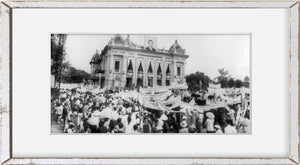 1950? photograph of Large crowd with banners outside presidential palace. Saigon