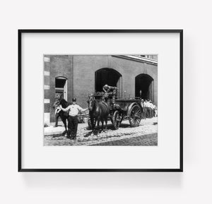 between ca. 1890 and 1933 photograph of Fireman with 2 horses and fire engine in