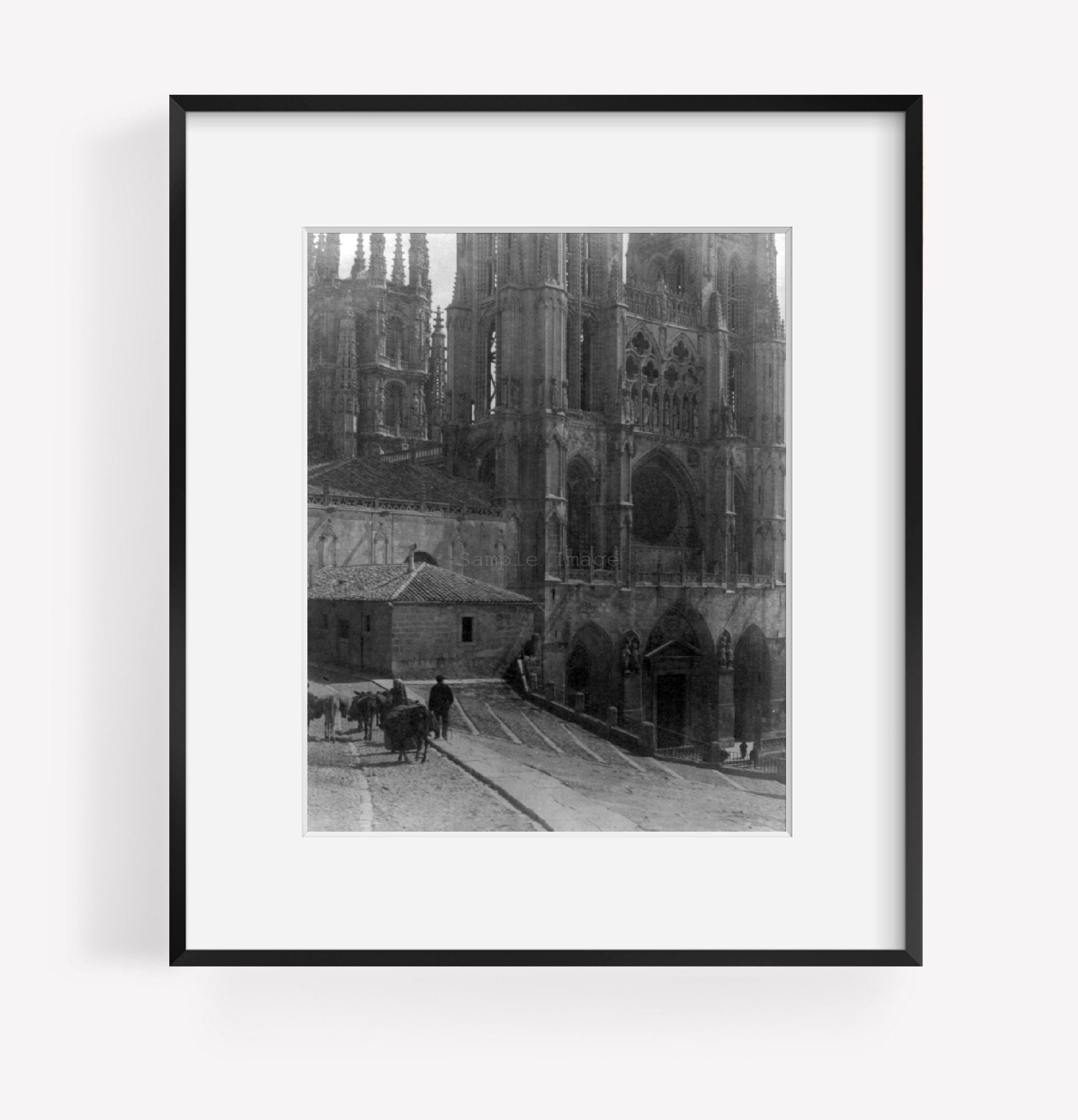 ca. 190- photograph of Burgos Cathedral Summary: Spain. ext., burros in fg.