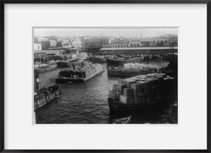 1922 photograph of Smyrna fire, Turkey Summary: Cargo boats and barges in foregr