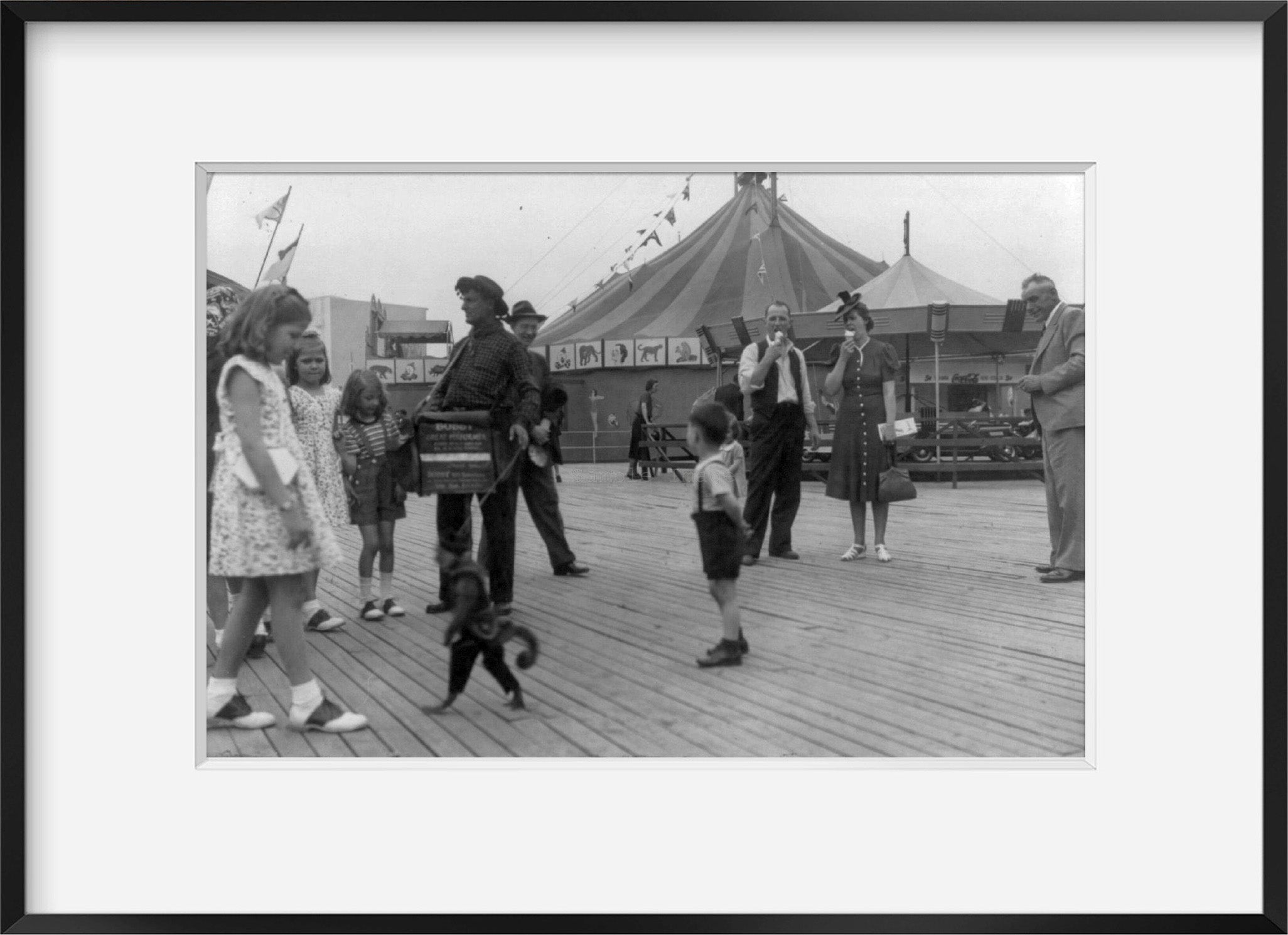1939 photograph of New York World's Fair: Organ grinder and monkey on midway