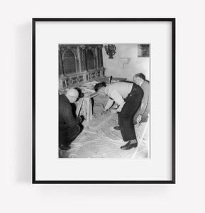 Photograph of Vain hunt for Shakespeare documents. Workmen shoveling sand from a