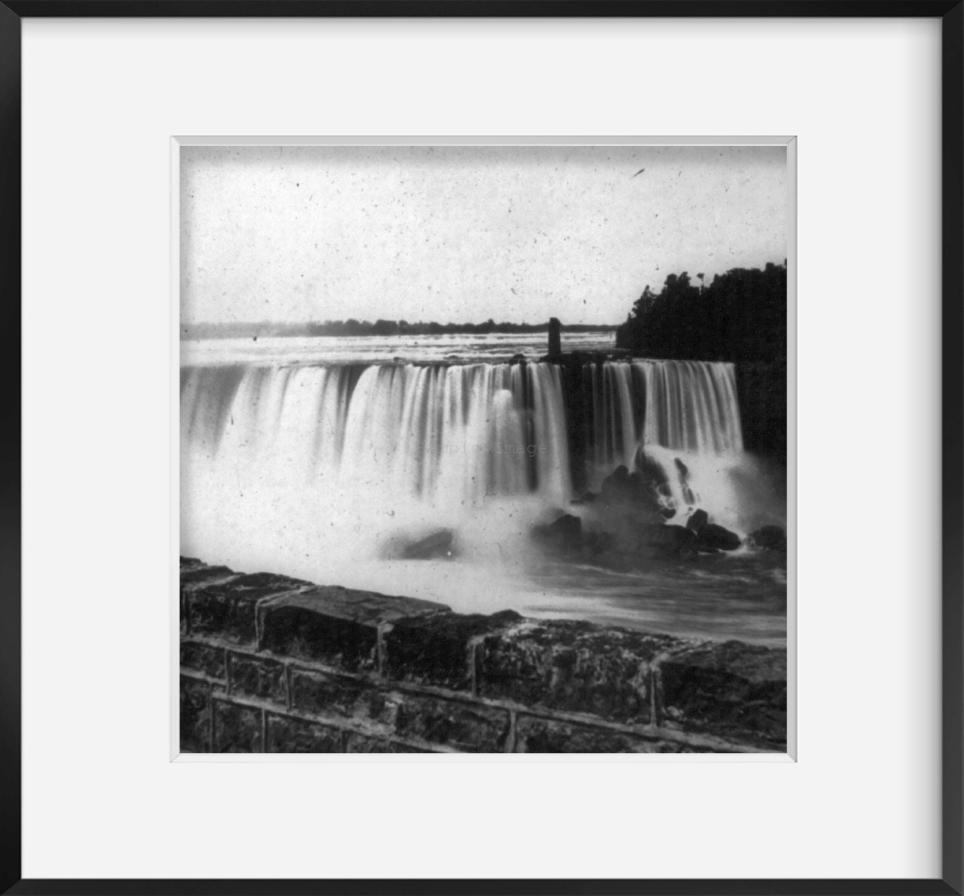 ca. 1895 photograph of View of Niagara Falls, with stone wall in foregrd.