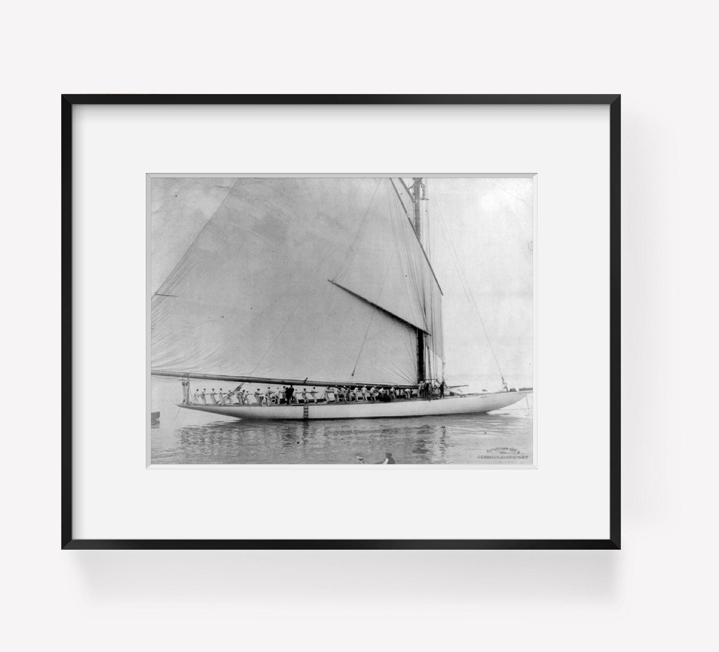 c1899 photograph of COLUMBIA Summary: Yacht with bow to right; crew in line alon