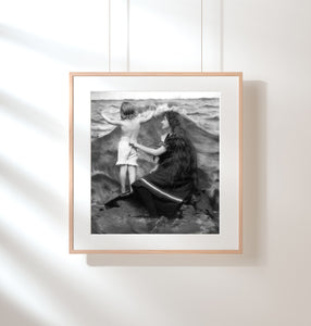 ca. 1900-10 photograph of Woman and girl on rock by ocean