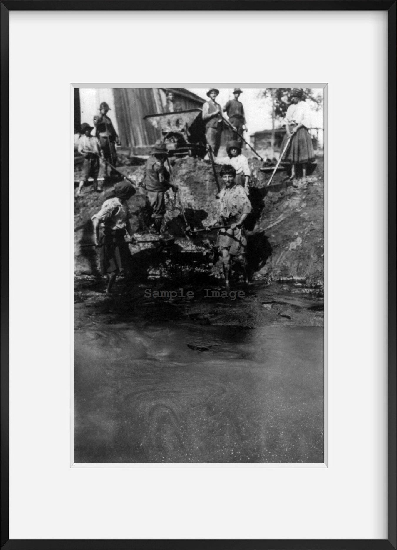 Photo: Group of people in Roumania skimming refuse off the surface of hot oil, 19