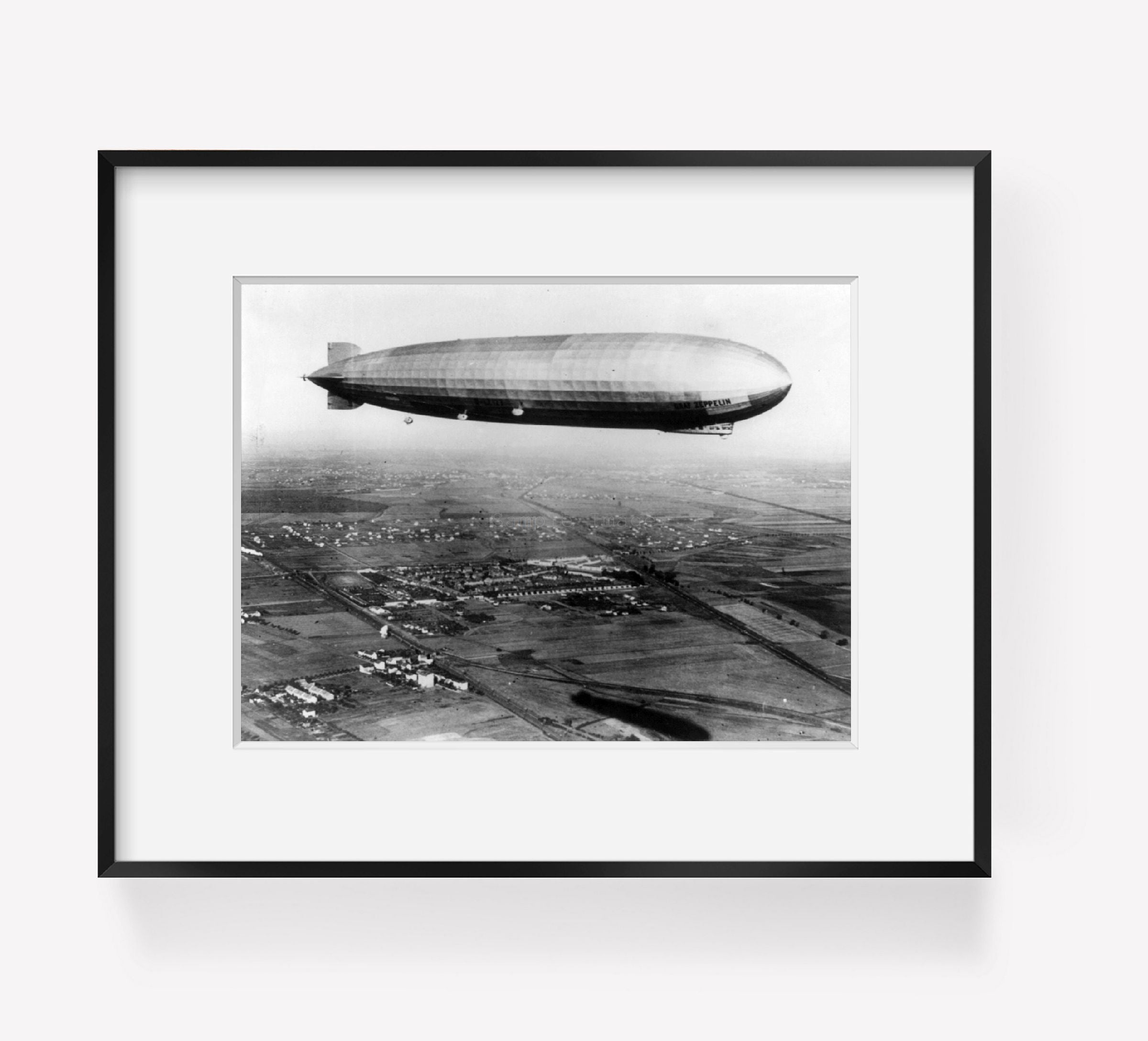 1928 photograph of Zeppelin in flight Summary: Millions follow reports of progre