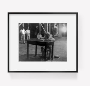 Photo: Puerto Rico: Man writing at table, c1937