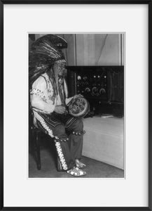 Photo: Chief Little Bear seated by radio, Coliseum at Chicago.