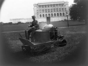 ca. 1903 photograph of Capitol grounds Summary: Man on steam-driven machine in f