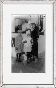 Photo: Guenevere (Sinclair) Gould, on ship, with three children, December 13, 1923