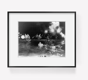 1950 Aug. 23 photograph of Light up the sky Summary: People in water with flares